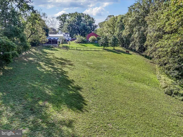 an aerial view of a house with outdoor space