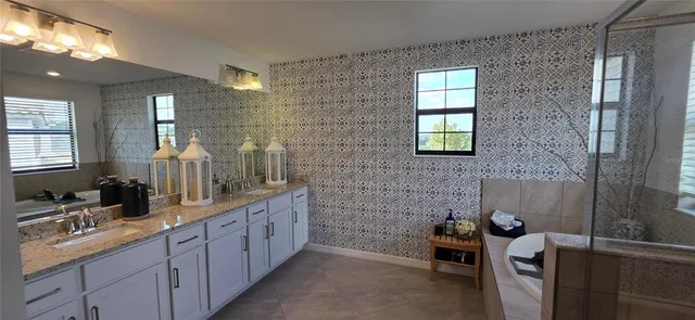 a living room with furniture a window and wooden floor