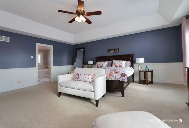 a bedroom with bed and window