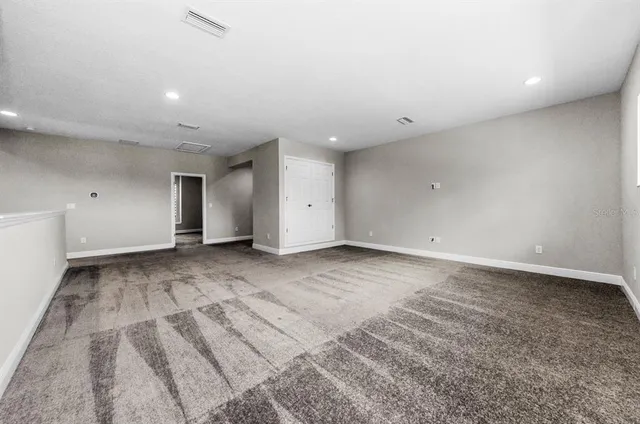 a front view of a house with yard garage and glass windows