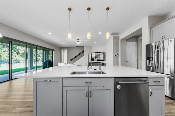 a kitchen with a stove and a refrigerator