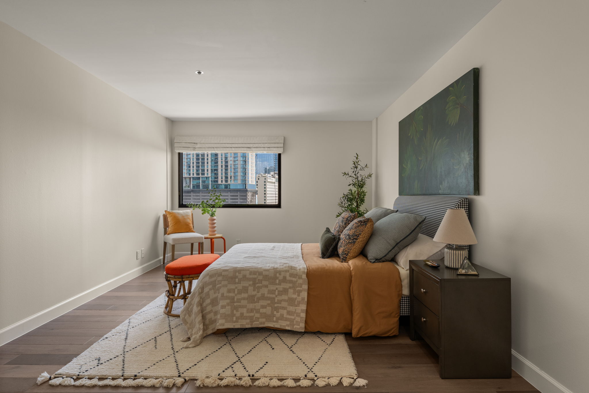 40 North Interstate Highway 35, Unit 11B2 Austin, TX 78701 - Photo 12 of 28 Well-lit sleeping quarters with rich hardwood flooring provide urban skyline views.