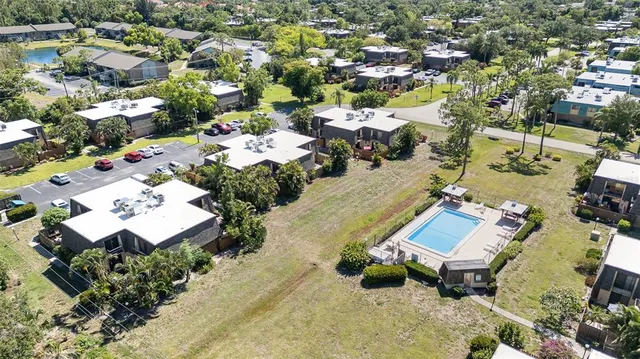 a view of a patio with table and chairs and potted plants