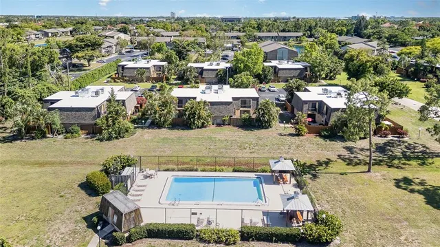 an aerial view of multiple houses with outdoor space