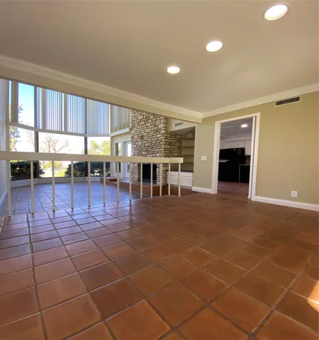 a view of a room with furniture and window