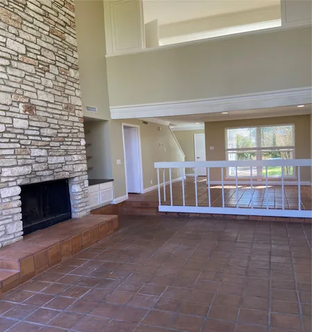 a view of a livingroom with furniture and a fireplace
