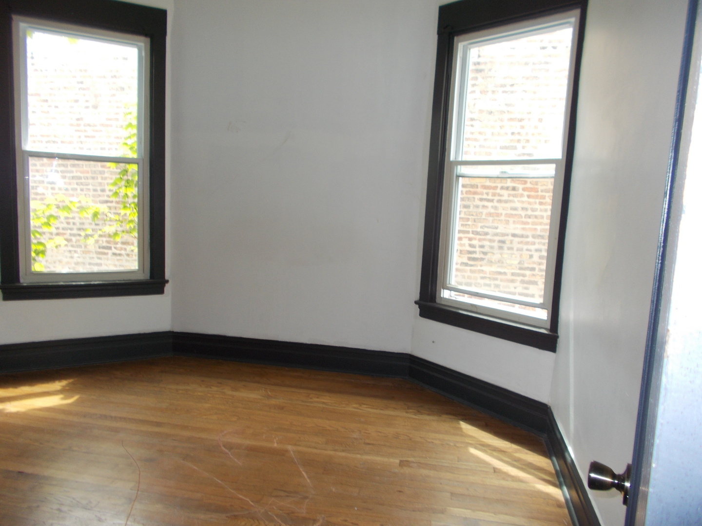 5715 South Sangamon Street, Unit 2 Chicago, IL 60621 - Photo 6 of 9 a view of an empty room with a window