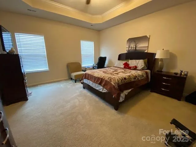 a bedroom with a bed and lamp