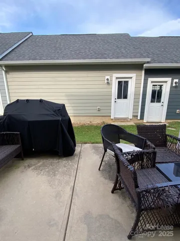 a backyard of a house with seating space