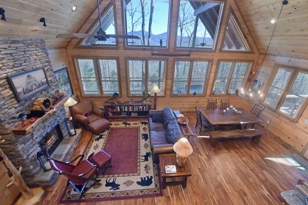 731 Native Trail Cherry Log, GA 30522 - Photo 35 of 56 a living room with furniture and a floor to ceiling window