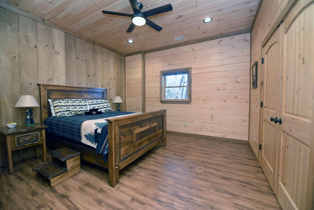 731 Native Trail Cherry Log, GA 30522 - Photo 49 of 56 a bedroom with a bed and wooden floor