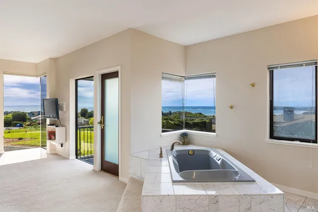 a view of a livingroom with furniture and a window