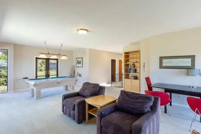 a bedroom with a large bed and a tv