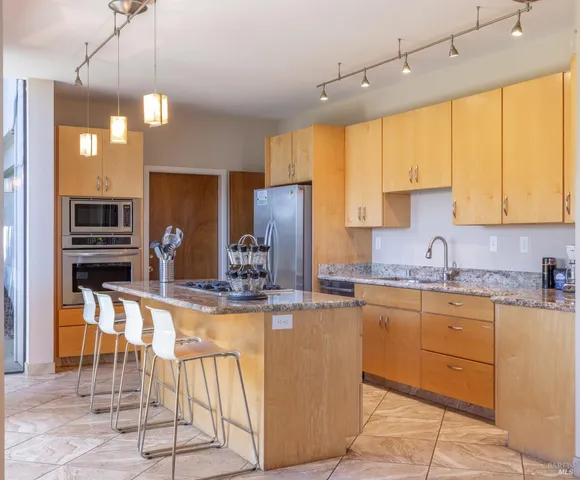 a view of a backyard with swimming pool and furniture