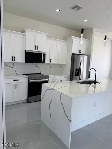 $359,000 | 459 Lockport Avenue South, Lehigh Acres, FL 33974