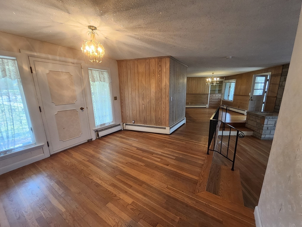 212 Chestnut Street Andover, MA 01810 - Photo 13 of 31 an empty room with wooden floor and windows