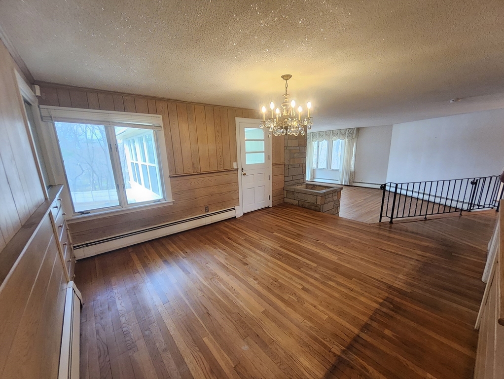 212 Chestnut Street Andover, MA 01810 - Photo 14 of 31 wooden floor in an empty room with a window