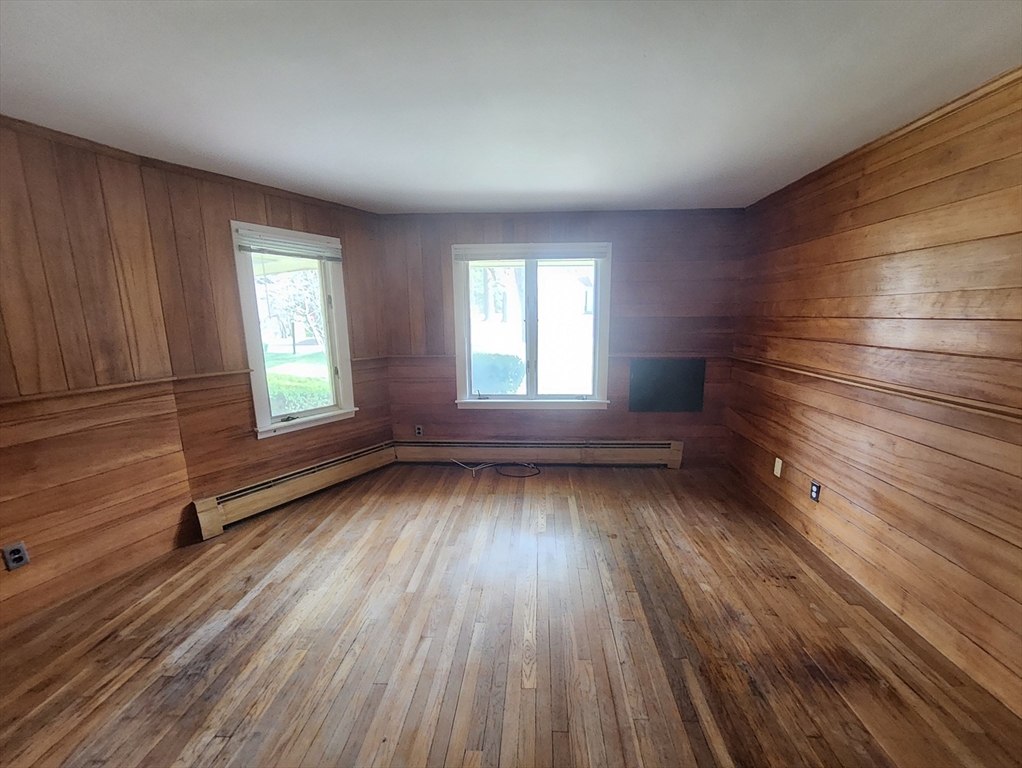 212 Chestnut Street Andover, MA 01810 - Photo 16 of 31 wooden floor in an empty room with a window