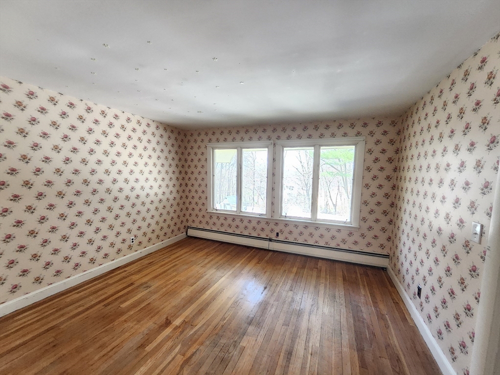 212 Chestnut Street Andover, MA 01810 - Photo 19 of 31 wooden floor in an empty room with a window