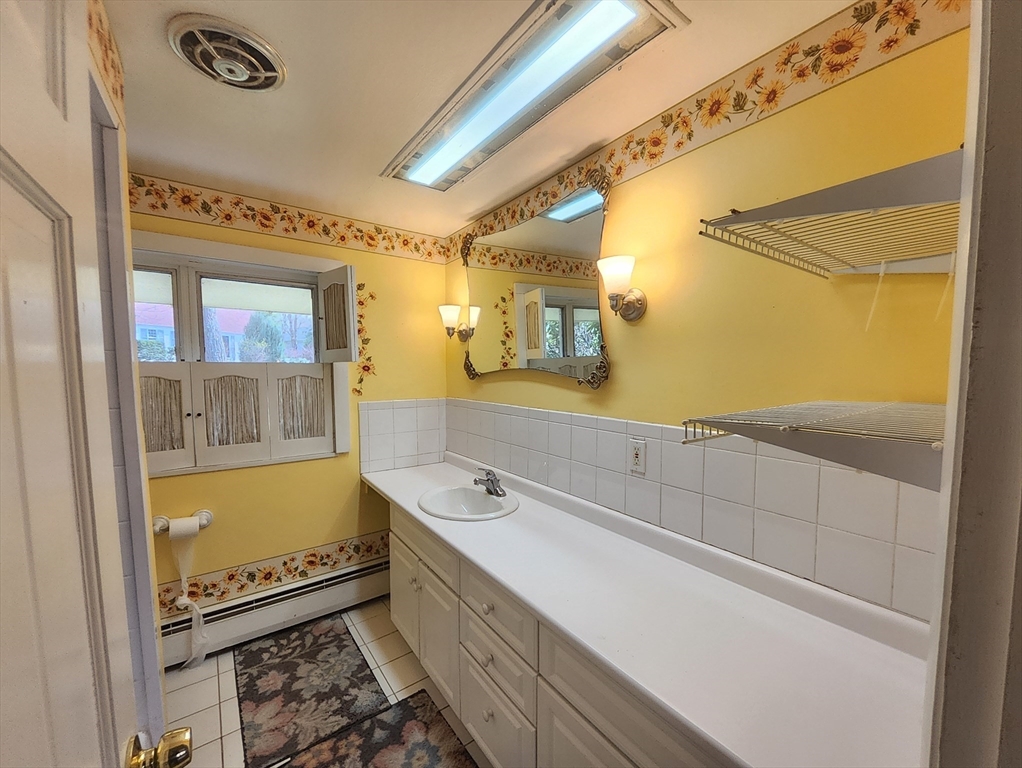 212 Chestnut Street Andover, MA 01810 - Photo 22 of 31 a bathroom with a bathtub and a sink