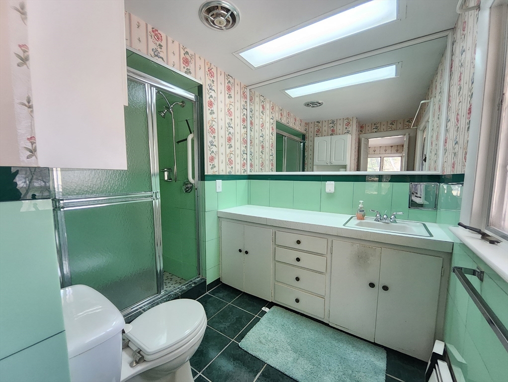 212 Chestnut Street Andover, MA 01810 - Photo 23 of 31 a bathroom with a toilet sink and mirror