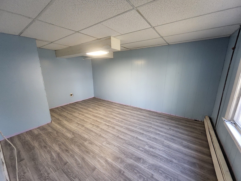 212 Chestnut Street Andover, MA 01810 - Photo 29 of 31 a view of empty room with wooden floor