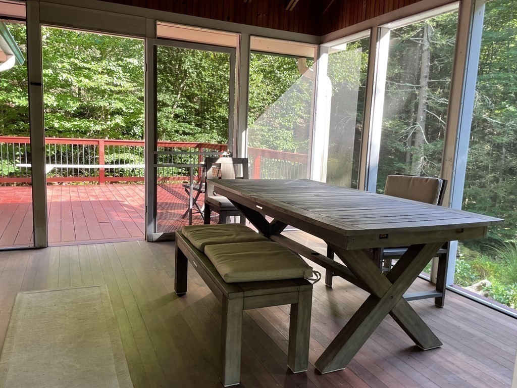 15 Chestnut Hill Road Leverett, MA 01054 - Photo 8 of 23 a view of a patio with table and chairs