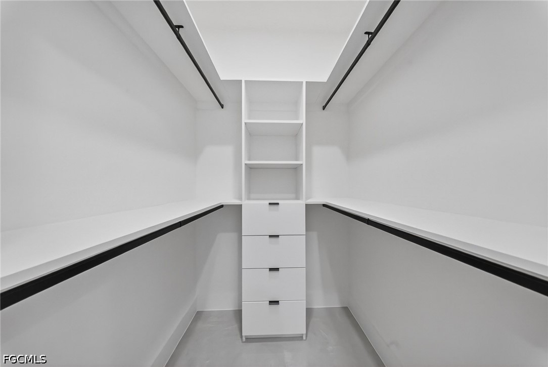4213 25th Street Southwest Lehigh Acres, FL 33976 - Photo 17 of 47 a view of an empty walk in closet
