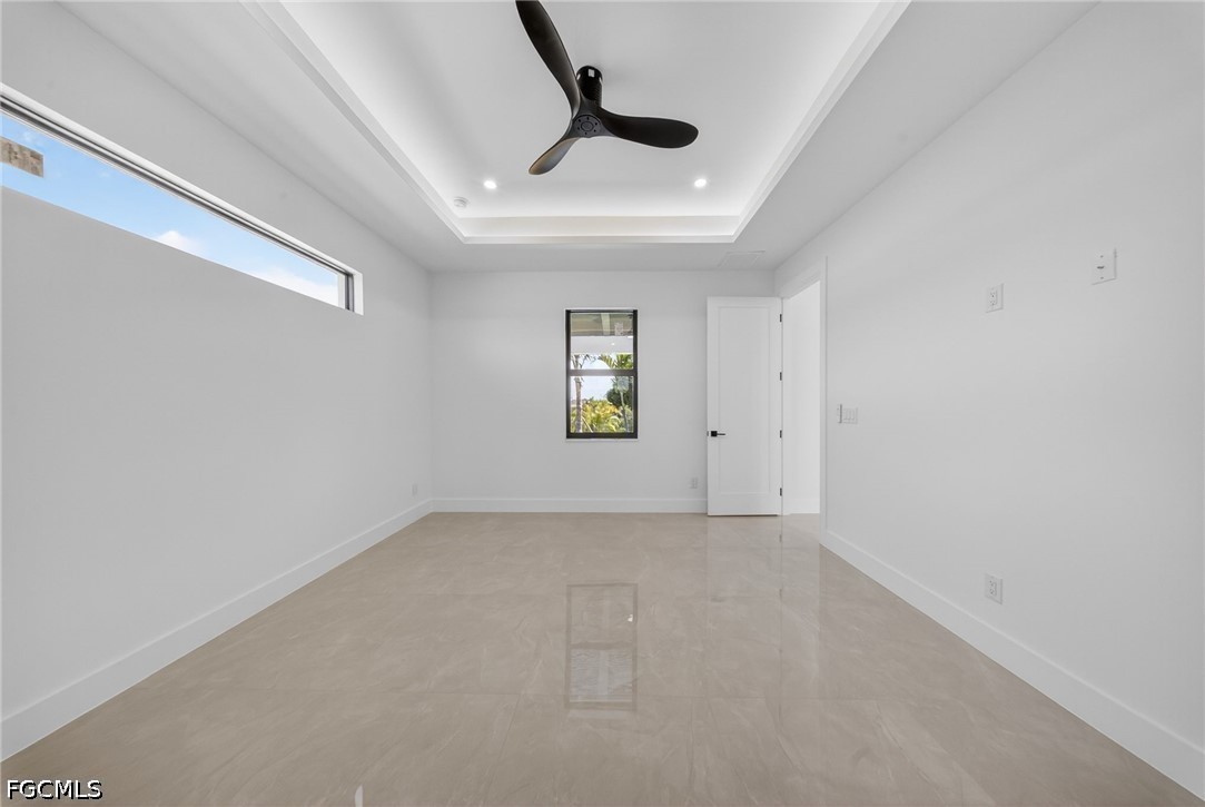 4213 25th Street Southwest Lehigh Acres, FL 33976 - Photo 18 of 47 an empty room with windows