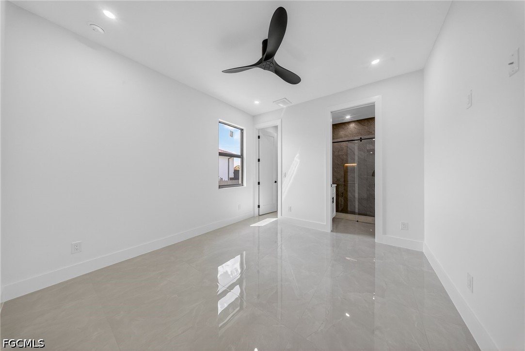 4213 25th Street Southwest Lehigh Acres, FL 33976 - Photo 25 of 47 a view of a livingroom with a ceiling fan and window