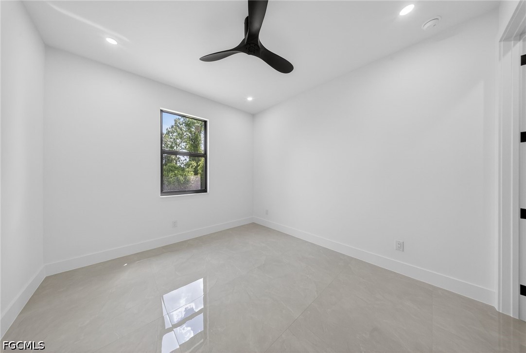 4213 25th Street Southwest Lehigh Acres, FL 33976 - Photo 29 of 47 an empty room with windows