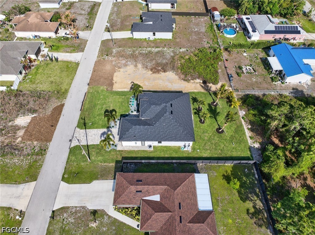4213 25th Street Southwest Lehigh Acres, FL 33976 - Photo 46 of 47 an aerial view of a house with a garden