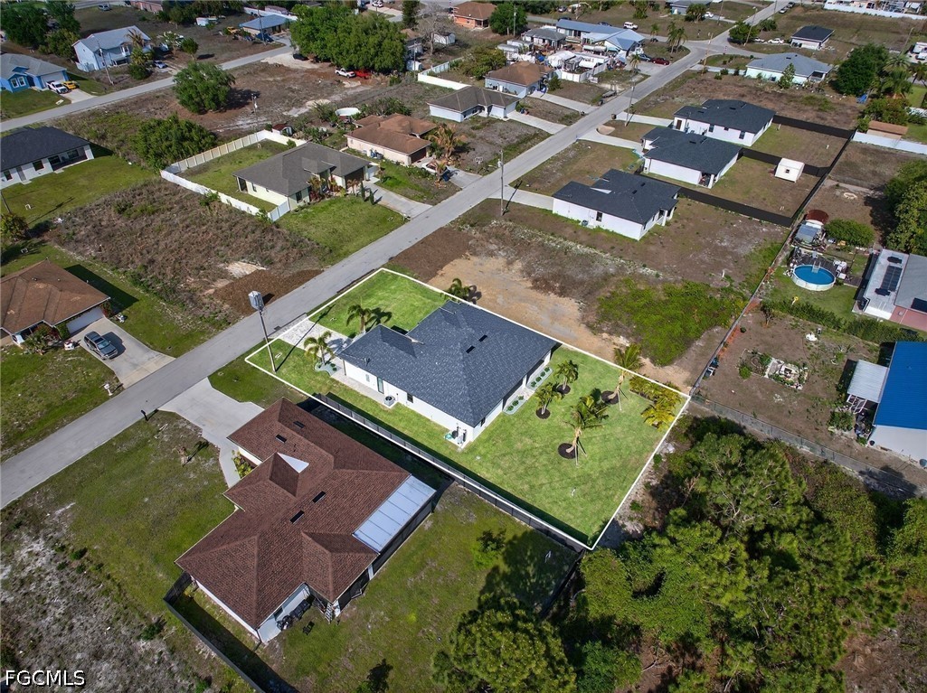 4213 25th Street Southwest Lehigh Acres, FL 33976 - Photo 47 of 47 an aerial view of a tennis ground and a building