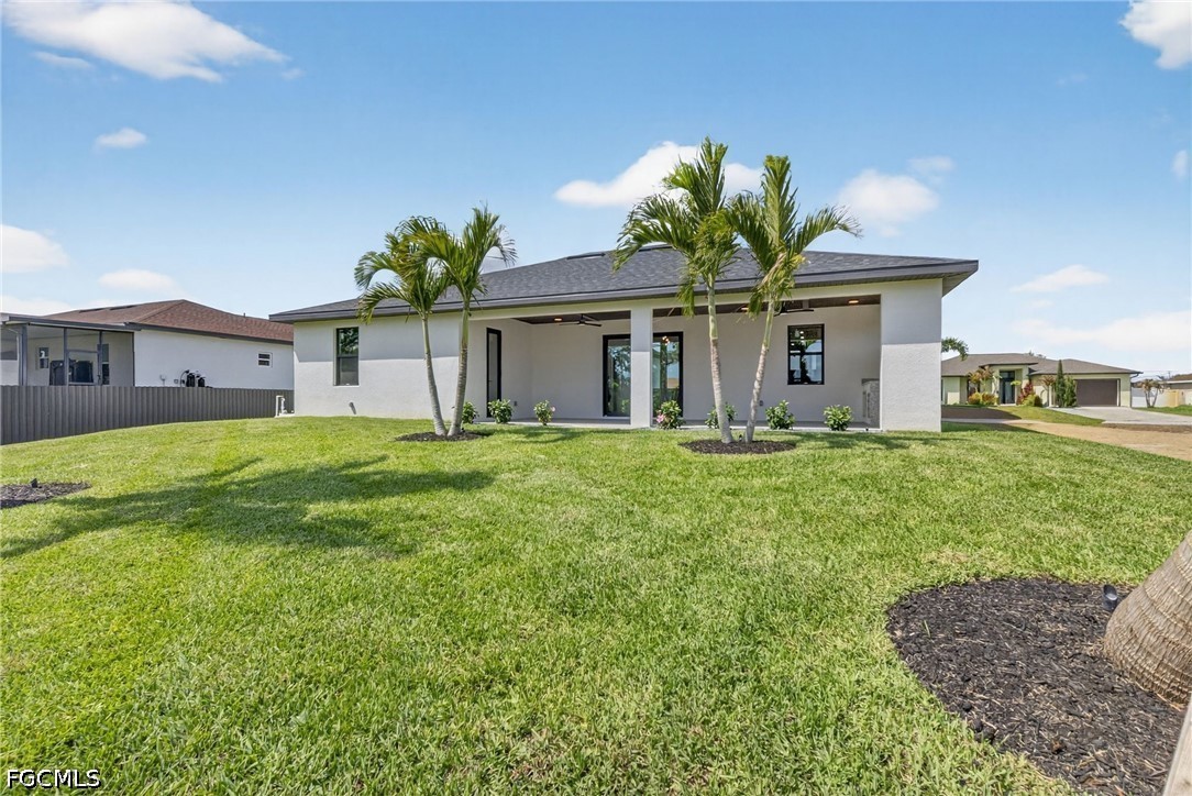 4213 25th Street Southwest Lehigh Acres, FL 33976 - Photo 5 of 47 a front view of a house with a yard