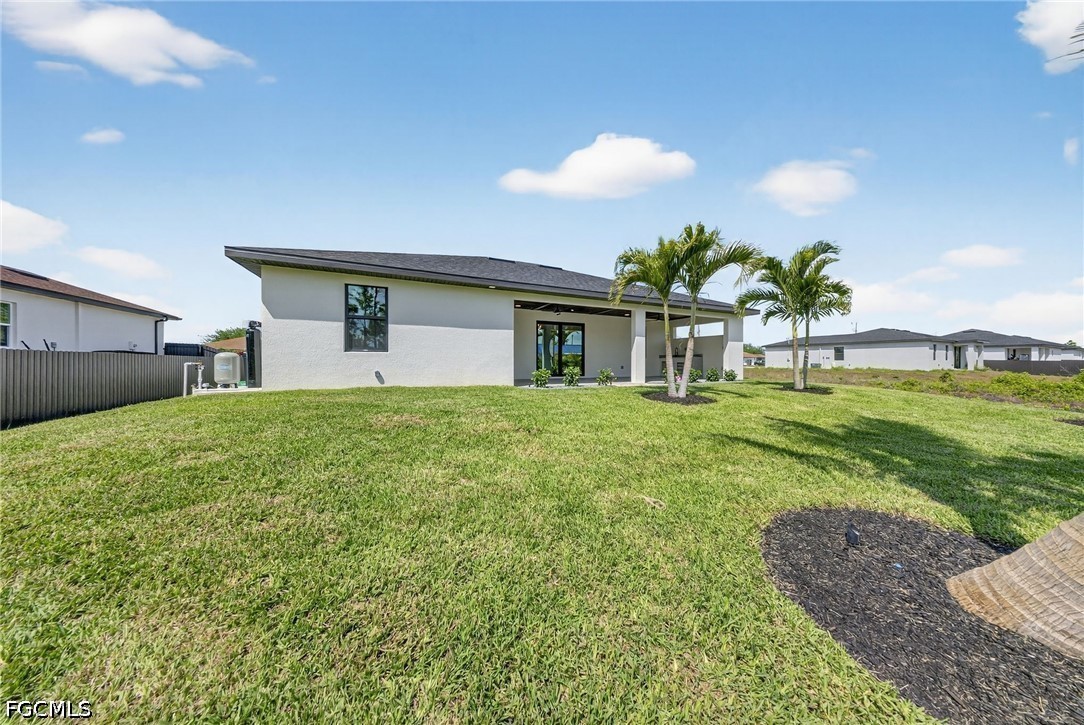 4213 25th Street Southwest Lehigh Acres, FL 33976 - Photo 10 of 47 a house view with a garden space