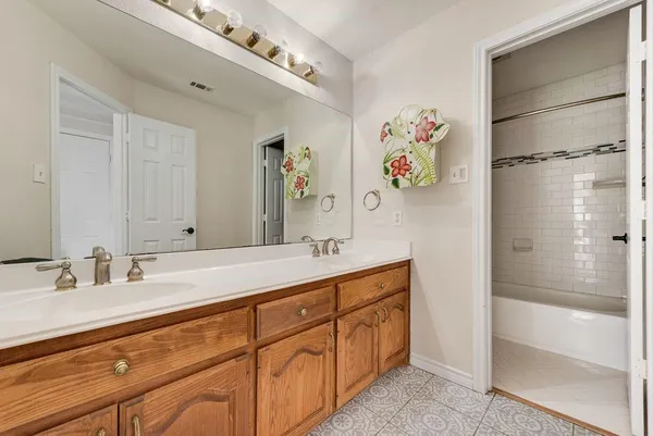 a bathroom with a double vanity sink mirror and double