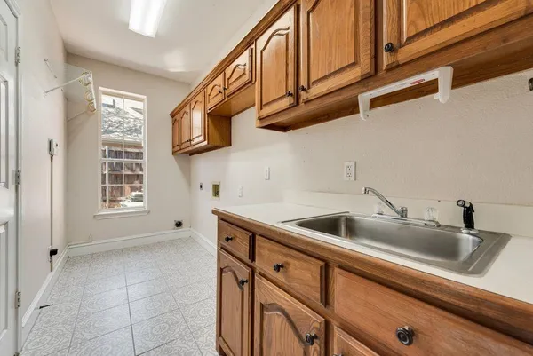 a kitchen with a sink and cabinets