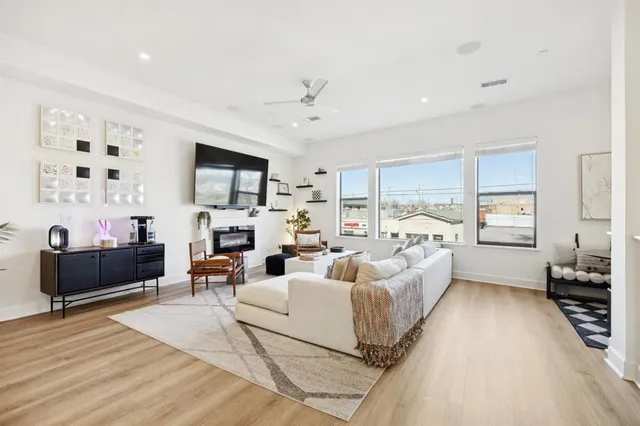 a living room with furniture or couch and a wooden floor