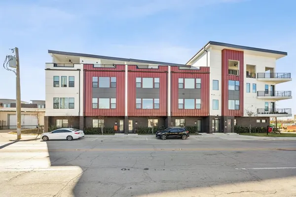 a front view of a building with street view