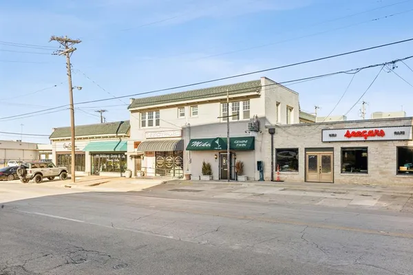 a view of a building with a street