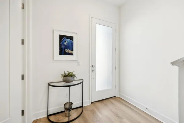 a view of a livingroom with furniture and wooden floor