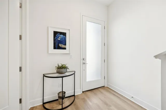 a view of a livingroom with furniture and wooden floor