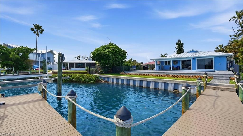 8009 Lagoon Road Fort Myers Beach, FL 33931 - Photo 12 of 48 brand new seawall, with dock and 10,000lbs lift