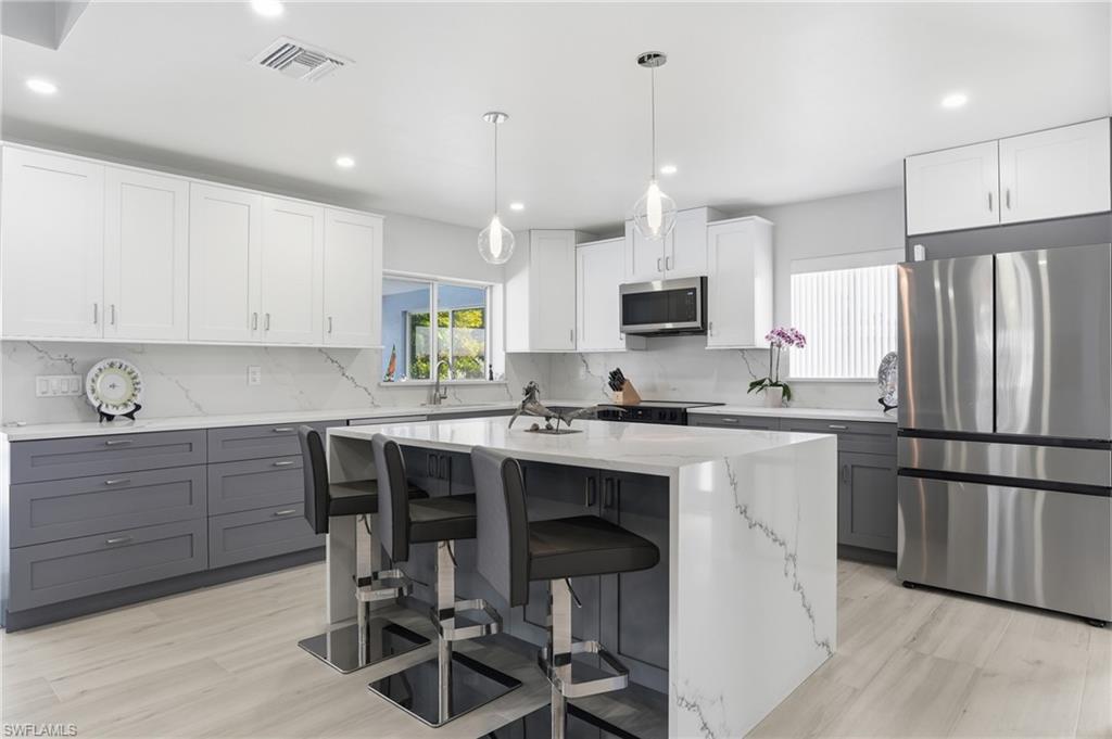 8009 Lagoon Road Fort Myers Beach, FL 33931 - Photo 23 of 48 waterfall kitchen island