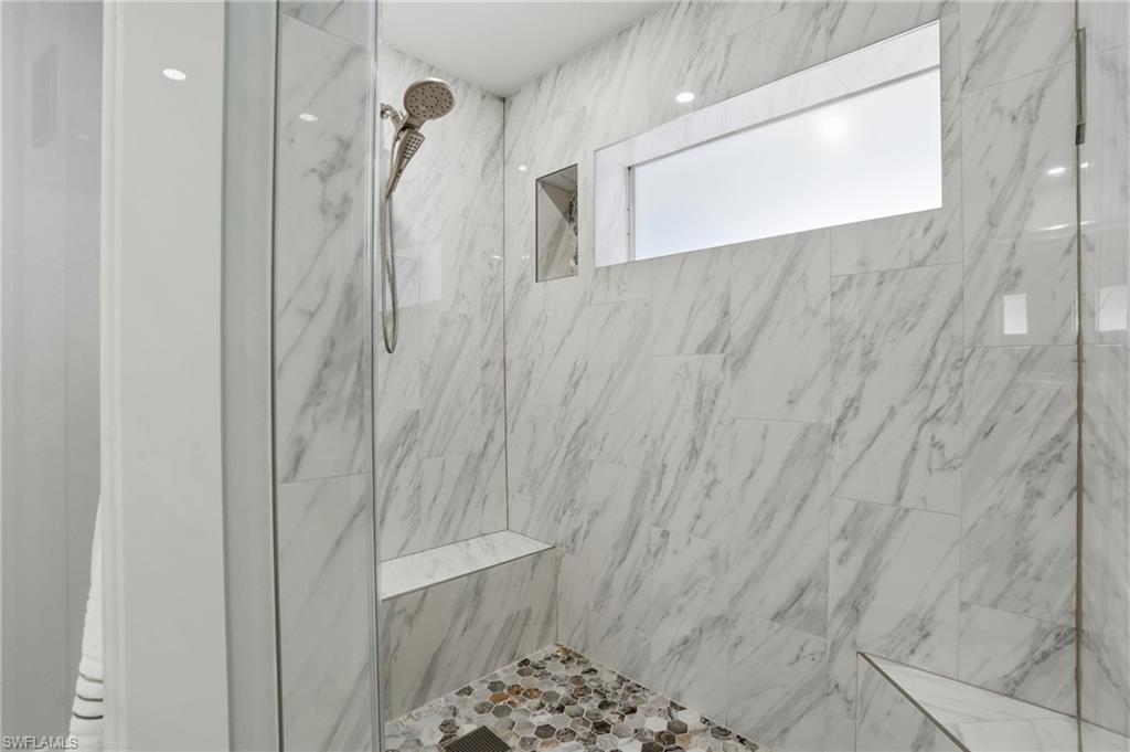 8009 Lagoon Road Fort Myers Beach, FL 33931 - Photo 29 of 48 primary bath with window in shower