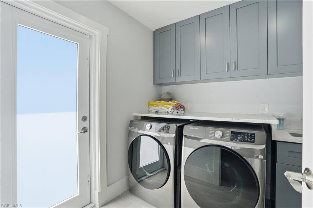 8009 Lagoon Road Fort Myers Beach, FL 33931 - Photo 37 of 48 laundry room with exterior door