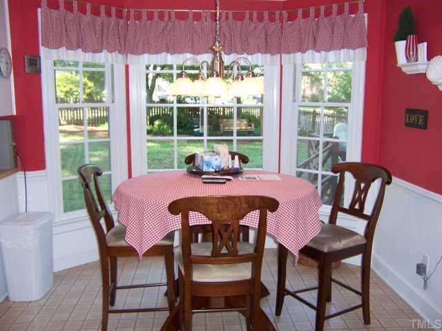 2713 Bolo Trail Raleigh, NC 27615 - Photo 8 of 12 a view of a dining room with furniture window and outside view
