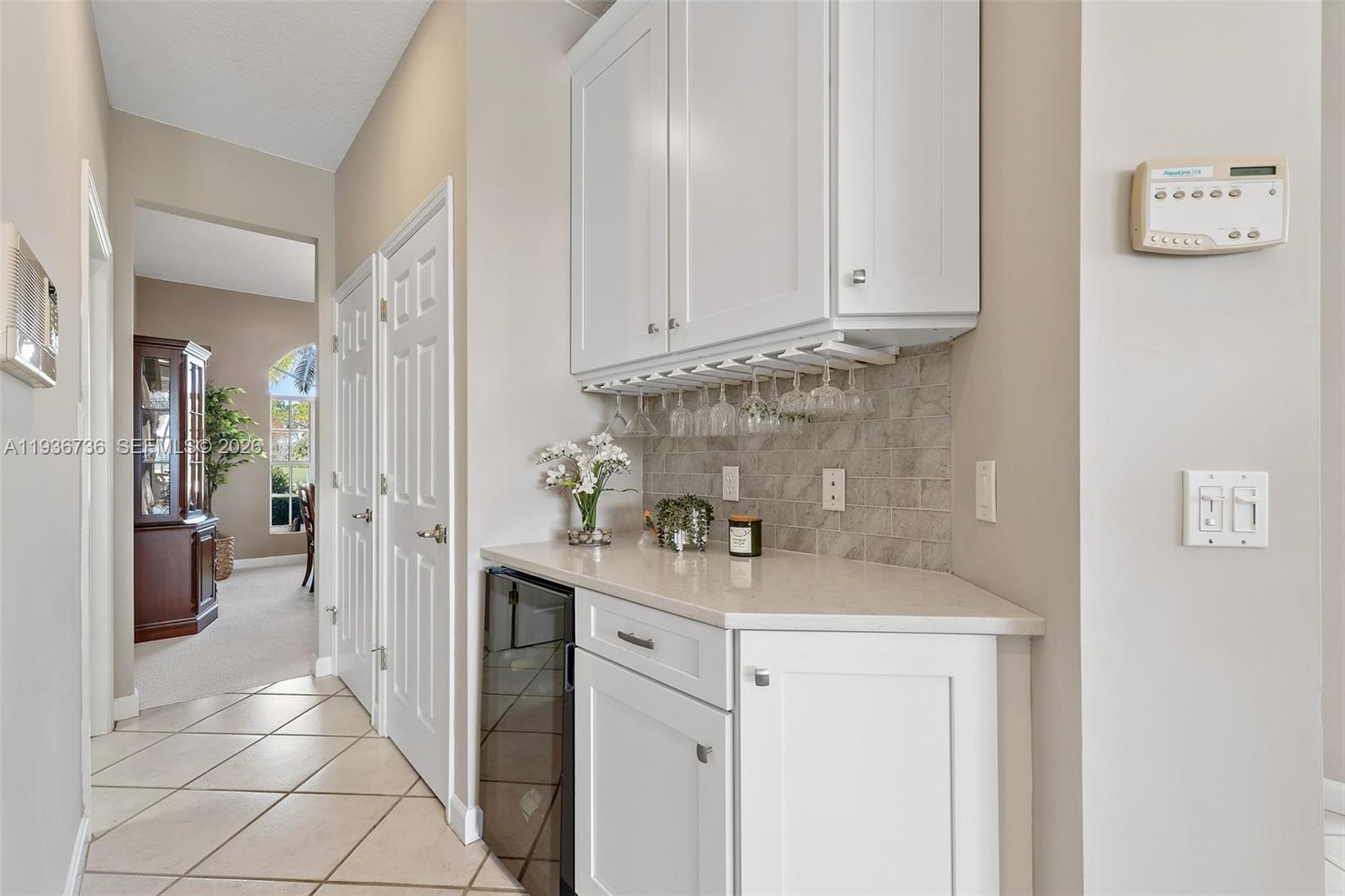 8185 Southeast Double Tree Drive Hobe Sound, FL 33455 - Photo 11 of 40 a kitchen with stainless steel appliances granite countertop a sink and cabinets