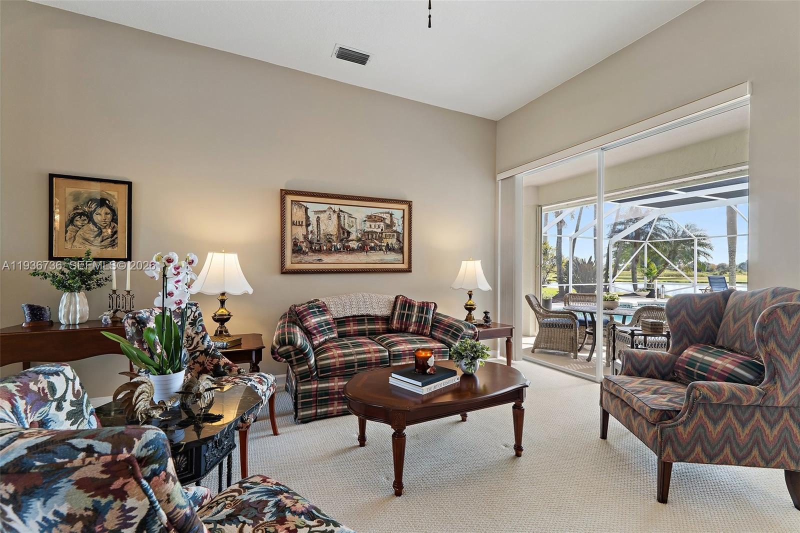 8185 Southeast Double Tree Drive Hobe Sound, FL 33455 - Photo 15 of 40 a living room with furniture and a large window