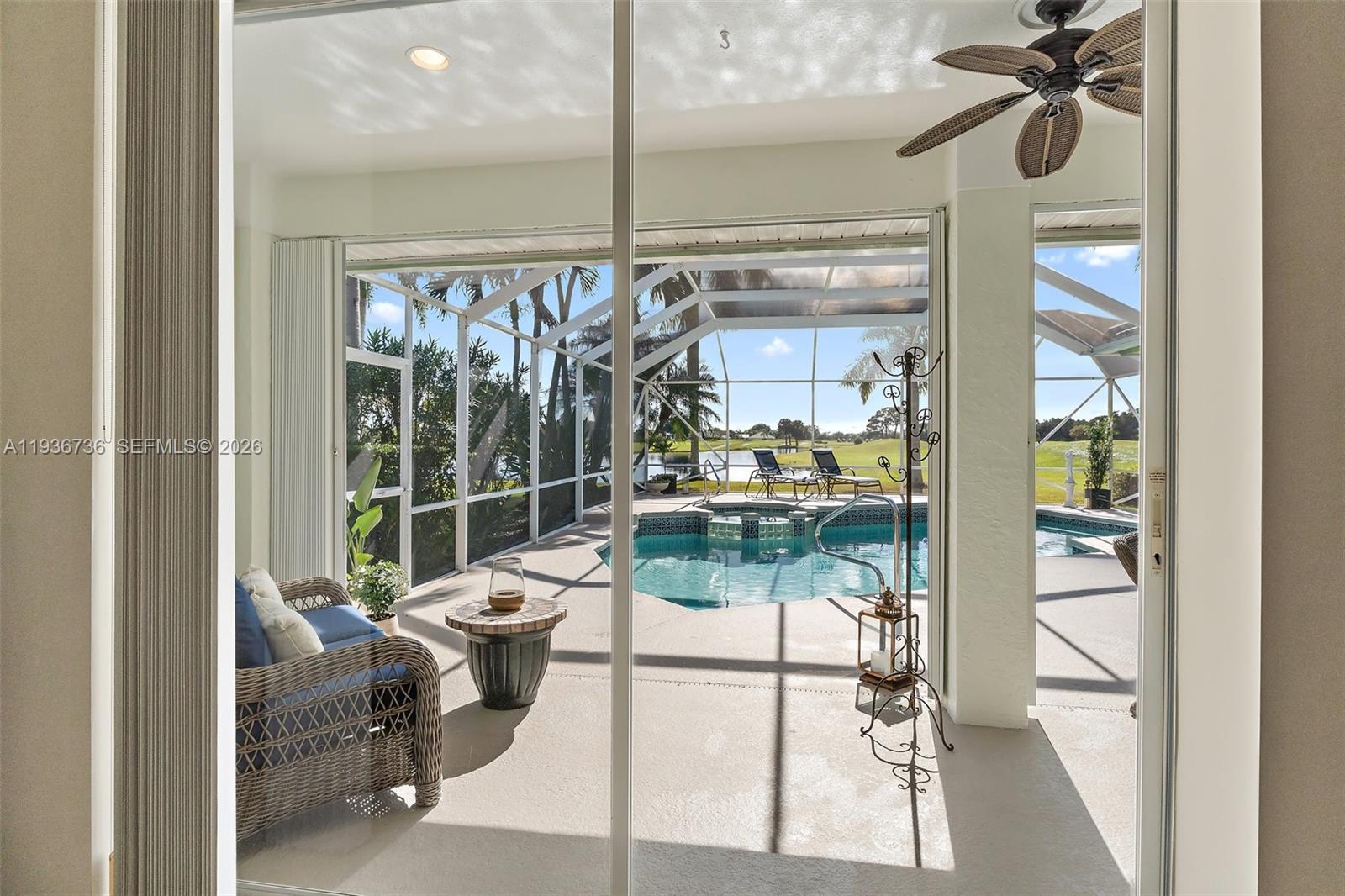 8185 Southeast Double Tree Drive Hobe Sound, FL 33455 - Photo 19 of 40 a view of a dining room with a chandelier
